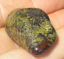 This is a photo of tumbled african bloodstone from western australia, not africa and metaphysically is used to detoxify organs and purify one's blood