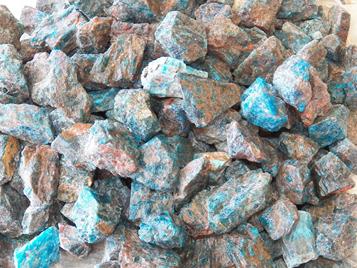 photo of rough blue apatite tumbling rock from Madagascar
