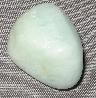 This is a photo of an aquamarine tumbled stone used for chakra balancing, crystal healing, and other metaphysical uses